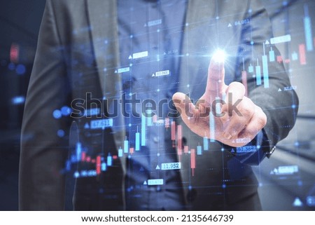Close up of businessman hand pointing at abstract growing forex chart on blurry background. Economy, up, growth and finance concept. Double exposure