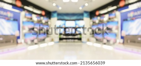 electronic department store show Television TV and home appliance blurred background Royalty-Free Stock Photo #2135656039