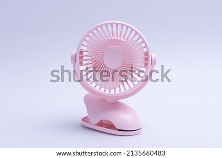 Clamp pink portable fan isolated on white background, clipping path