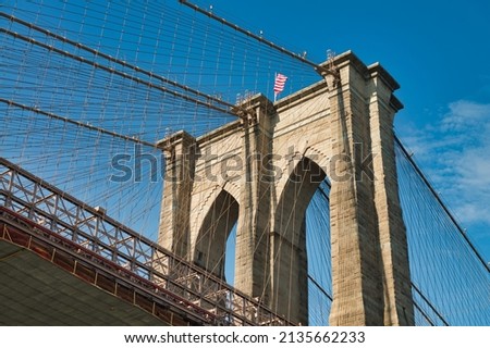 Skyward view of Brooklyn Bridge in New York City.