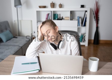 Desperated young freelancer in front of laptop. Anxiety and depression on freelancing concept.