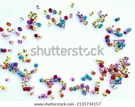 Multicolored letters of the alphabet on a white background.