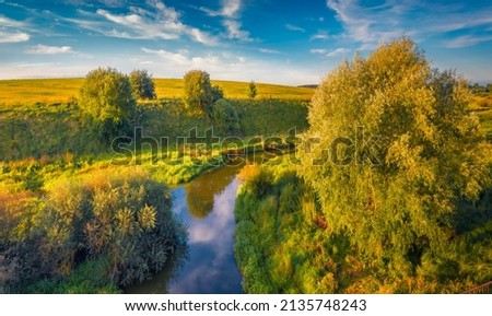 Perfect morning scene of Seret river. Fresh green trees on the shore of small river. Splendid outdoor scene of Ukraine countryside. Beauty of nature concept background.