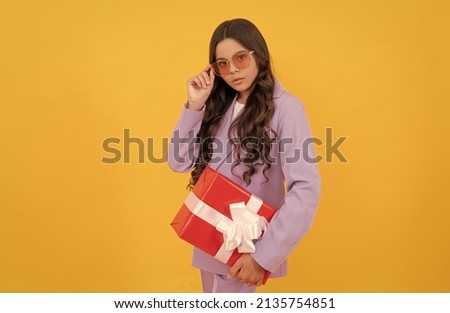 fashionable kid hold present. child prepare for holiday. happy valentines day.