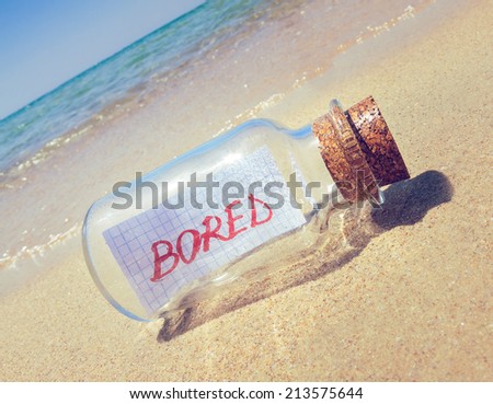 Creative boredom concept. Bottle with a message "Bored"