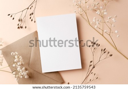 Greeting card or invitation mockup with envelope and dry twigs decorations Royalty-Free Stock Photo #2135759543