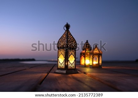 Ramadan lanterns  lit in the outdoor during a dusky evening. Royalty-Free Stock Photo #2135772389