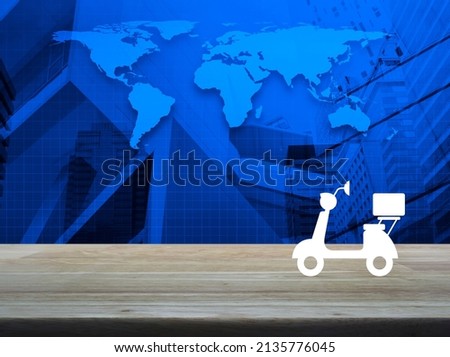 Motorcycle flat icon on wooden table over world map, modern city tower and skyscraper, Business delivery service concept, Elements of this image furnished by NASA