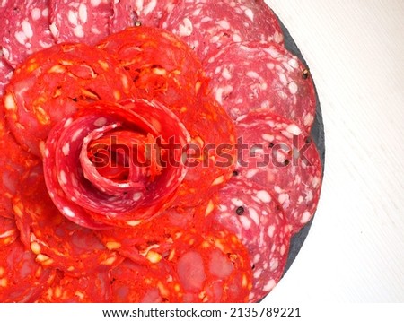 Sausage plate with chorizo and salami. On a white background