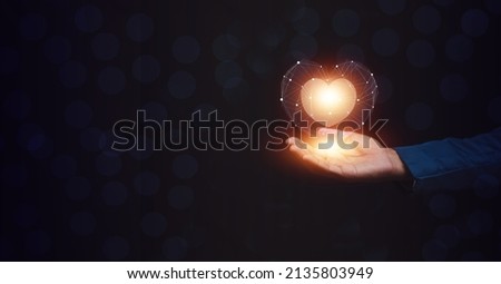 hands holding digital heart on visual screen , health care, love, organ donation,world heart day, world health day,