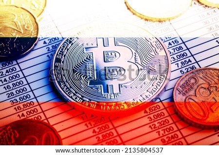 Physical version of Bitcoin and Litecoin with the Russian flag. Conceptual image of cryptocurrencies in russia