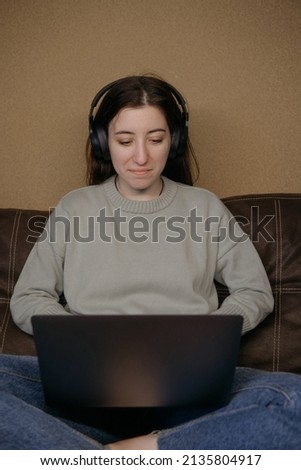 ukrainian woman freelancer working with laptop at home