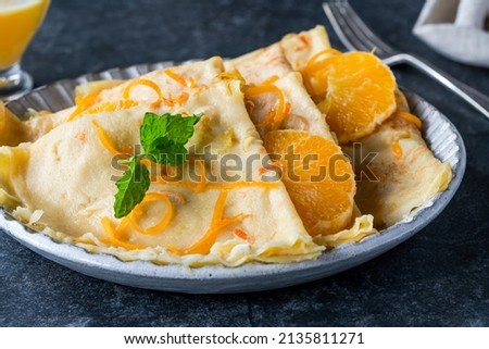Crepes Suzette - French pancakes with orange liqueur sauce Royalty-Free Stock Photo #2135811271