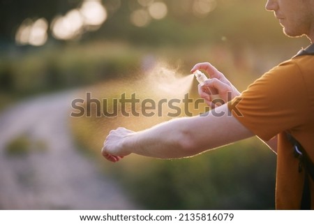 Prevention against mosquito bite in tropical destination. Man applying insect repellent on his hand.
 Royalty-Free Stock Photo #2135816079
