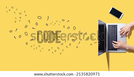 Code with person working with a laptop