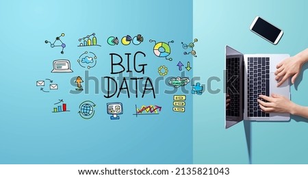 Big data theme with person working with a laptop