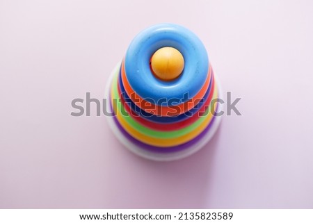 Baby toys on color background. Child development concept.