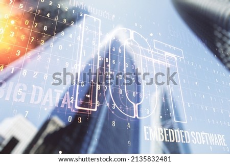 Abstract virtual IOT hologram on office buildings background. Multiexposure