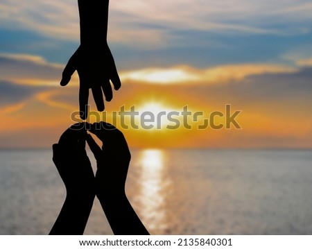 Silhouette symbol of peace day aid concept peace building assistance against a blurred background of sunset in the sea