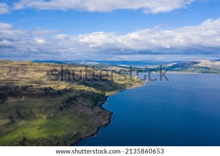 Scottish mountains with sea water on a sunny day, aerial shot, Isle of Mull