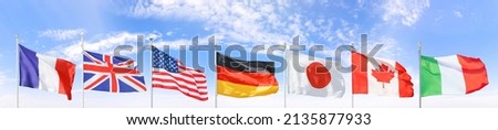 All G7 (Group of Seven) national flags set against blue sky. Clipping path for all flags included