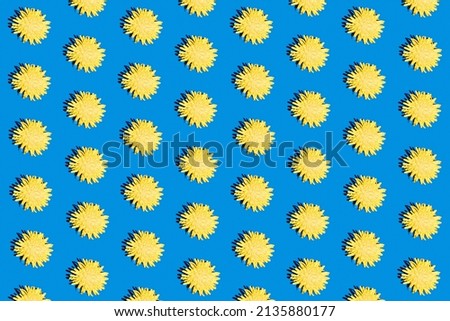 Trendy hard shadow sun light yellow dandelion or chamomile daisy flower on a bright blue background. Isometric hot summer or fall seamless pattern wallpaper design. Funky 90's nostalgia concept.