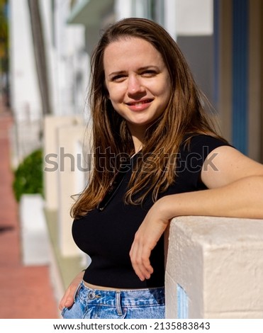 Pretty girl posing for the camera in the Art Deco District of South Beach Miami - travel photography
