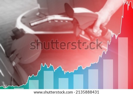 Male hand with fuel nozzle and rising chart showing gasoline price increase during energy crisis in the world Royalty-Free Stock Photo #2135888431