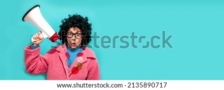 Funny young female posing isolated on blue studio wall background. Lifestyle concept of sincere emotions of people. Space for copy layouts. Discount, sale season. Information concept. Attention news!