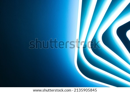 Abstraction, banner background. Blue bright light from a multi-level LED lamp. Royalty-Free Stock Photo #2135905845