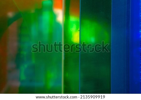 Colorful abstract background. Green, blue and orange colored background photo. Defocused image.