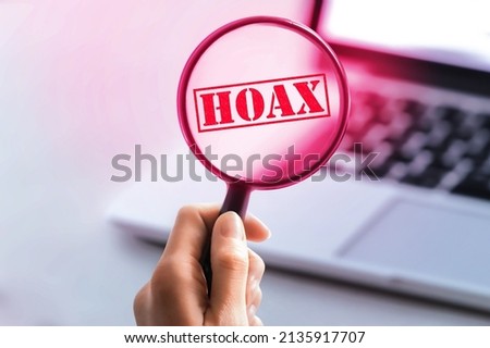 Detection of Haox on internet searching. laptop, computer on background. Internet search concept. Closeup of young woman looking on computer screen fake news. Royalty-Free Stock Photo #2135917707
