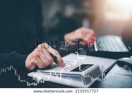 Concept of tax payment optimisation business finance,Man using calculator and taxes icon on technology screen,income tax and property, background for business, individuals and corporations such as VAT Royalty-Free Stock Photo #2135917727