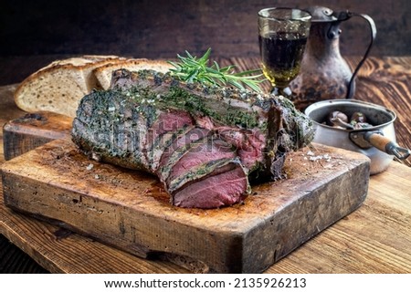 Barbecue Saddle of Venison on Cutting Board Royalty-Free Stock Photo #2135926213
