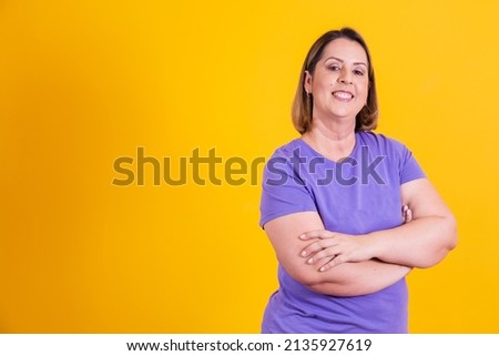 chubby older woman with arms crossed with free space for text