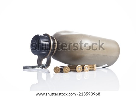 The old canteen with bullets on white background. 