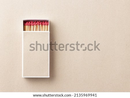 big size of matchbox on light brown paper background with copy space for text or image Royalty-Free Stock Photo #2135969941