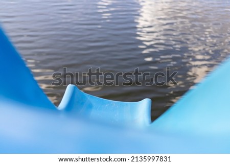 Blue water slide on the lake.