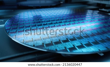 Macro Shot of Silicon Wafer During Production at Advanced Semiconductor Foundry, that produces Microchips Royalty-Free Stock Photo #2136020447