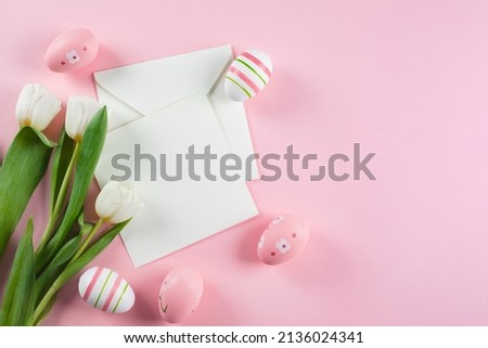 Flat lay composition with painted Easter eggs on pink background. Place for text. Top view. Easter holiday concept. Easter Mockup