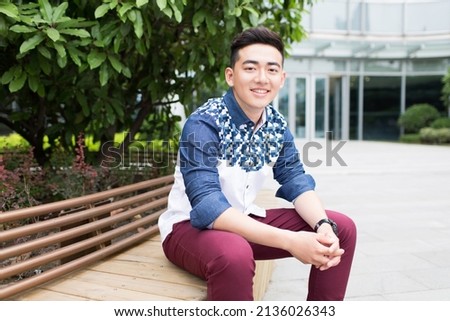 young fashion handsome man in the outdoor coffee Shop, casual lifestyle