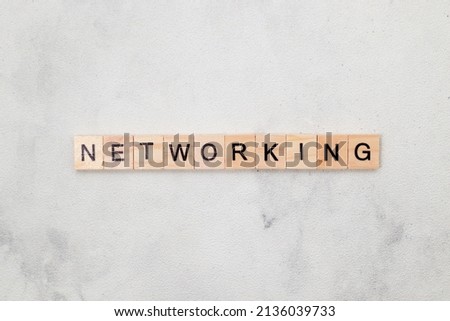 Top view Networking word on wooden cube letter block on white background. Business concept