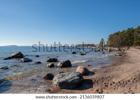 View of the shore and Gulf of Finland in spring, Raudden, Hanko, Finland Royalty-Free Stock Photo #2136039807