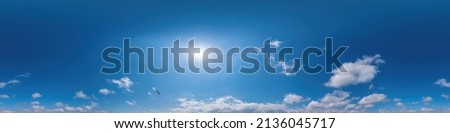 Blue sky panorama with Cirrus clouds in Seamless spherical equirectangular format. Full zenith for use in 3D graphics, game and editing aerial drone 360 degree panoramas for sky replacement.