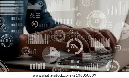 Businessman uses capable laptop computer to analyze business data analytic for marketing strategy and customer relationship management