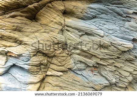 The rocks are colorful rock formations that have been deposited over hundreds of years. Background and texture. High quality photo