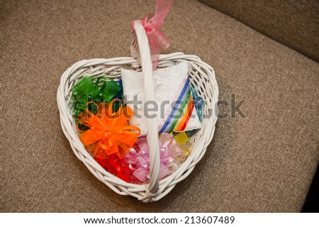 Wattled basket with multi-coloured bows.
