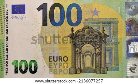 large fragment of obverse side of €100 one hundred Euro bill banknote, currency of the European Union with Baroque and rococo style architecture on design, selective focus of European euros money