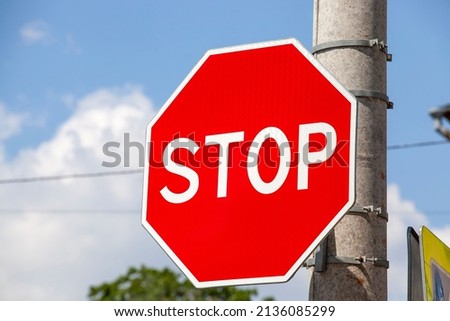 a road sign stop for regulating traffic on the carriageway, regulating the traffic of cars using road signs