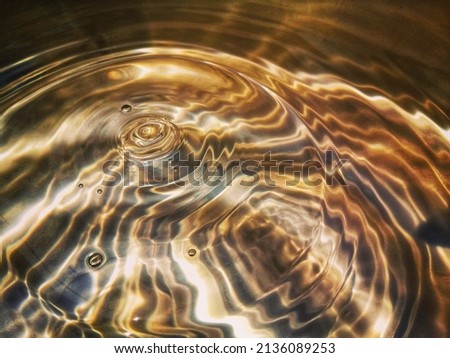 Closeup​ blur​ abstract​ of​ surface​ blue​ water. Abstract​ of​ surface​ blue​ water​ reflected​ with​ sunlight​ for​ background.Top​ view​ of blue​ water.​ Water​ splashed​ use​ for​ graphic​ design Royalty-Free Stock Photo #2136089253